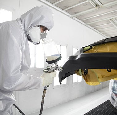 Collision Center Technician Painting a Vehicle | LeadCar Toyota Wausau in Wausau WI